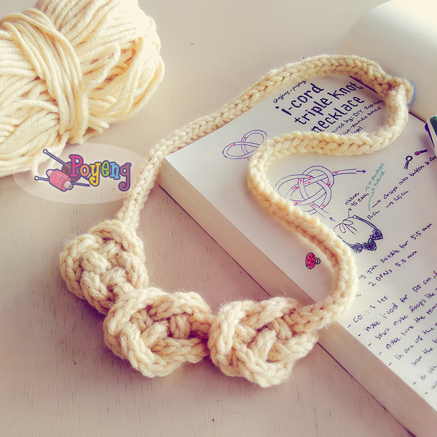 I-cord triple knot necklace handknitted in bulky yarn with a button clasp